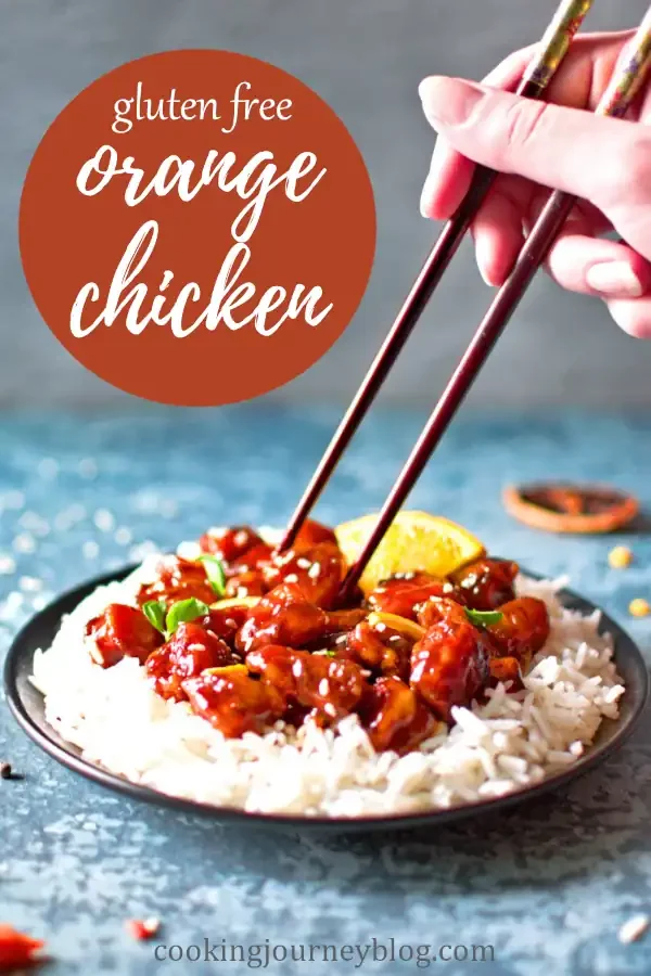 Grabbing gluten-free orange chicken with chopsticks