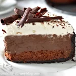 Mississippi mud pie recipe - a slice of layered chocolate cake served on a white plate