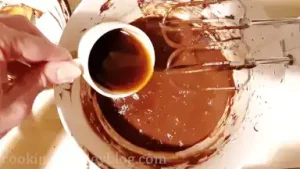 Beat in coffee mixture until just combined, scraping the sides.