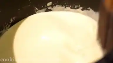 In a small pan heat 350 ml/ 11.82 fl oz whipping cream. Sift in sugar, add rum essence and stir gently.