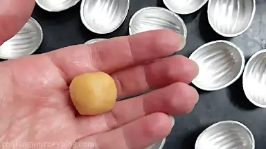 Divide the dough into the small pieces. Roll between your palms to make a ball.