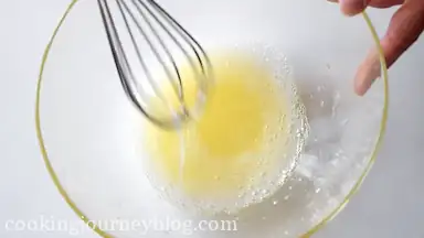 Whisk 2 egg whites in a large bowl.