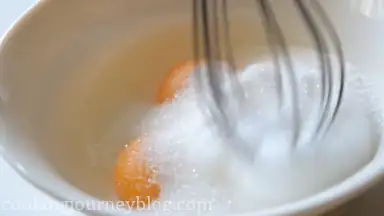 In another bowl, whisk egg yolks with sugar.