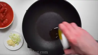 Heat olive oil in a pan.