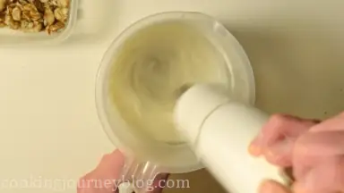 Whip milk with powder.