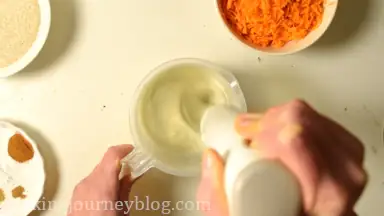Whisk eggs with oil until foamy.