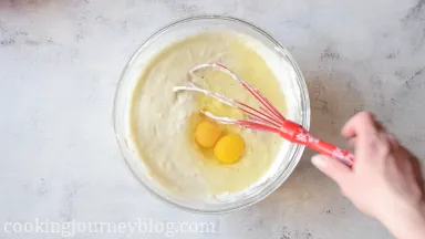 Whisk in eggs.