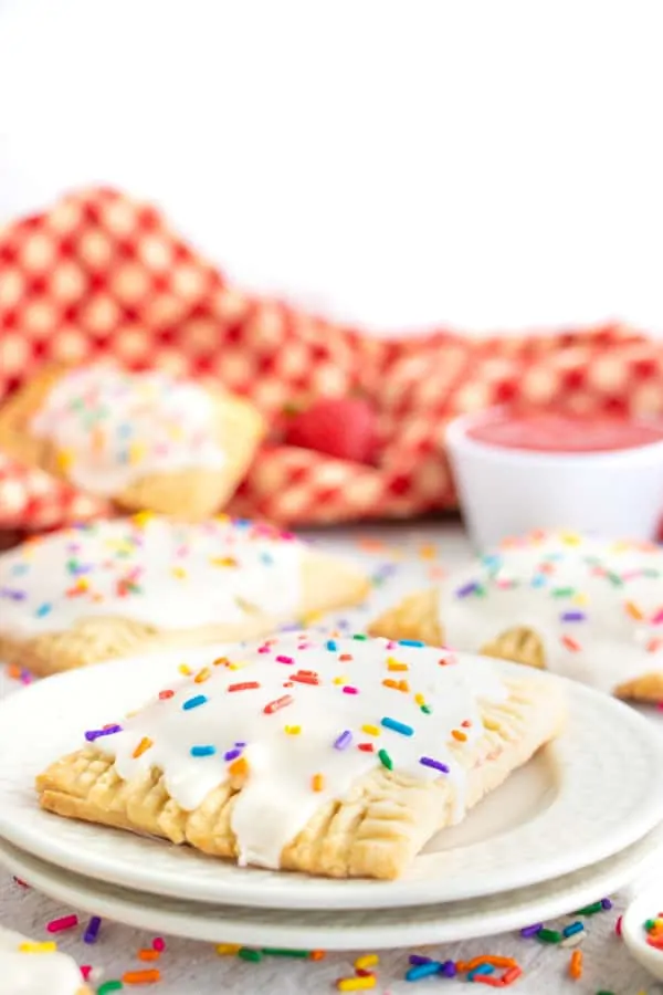 Pop Tart s served on white plates with red napkins