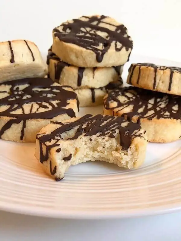 Cookies on a plate, topped with chocolate
