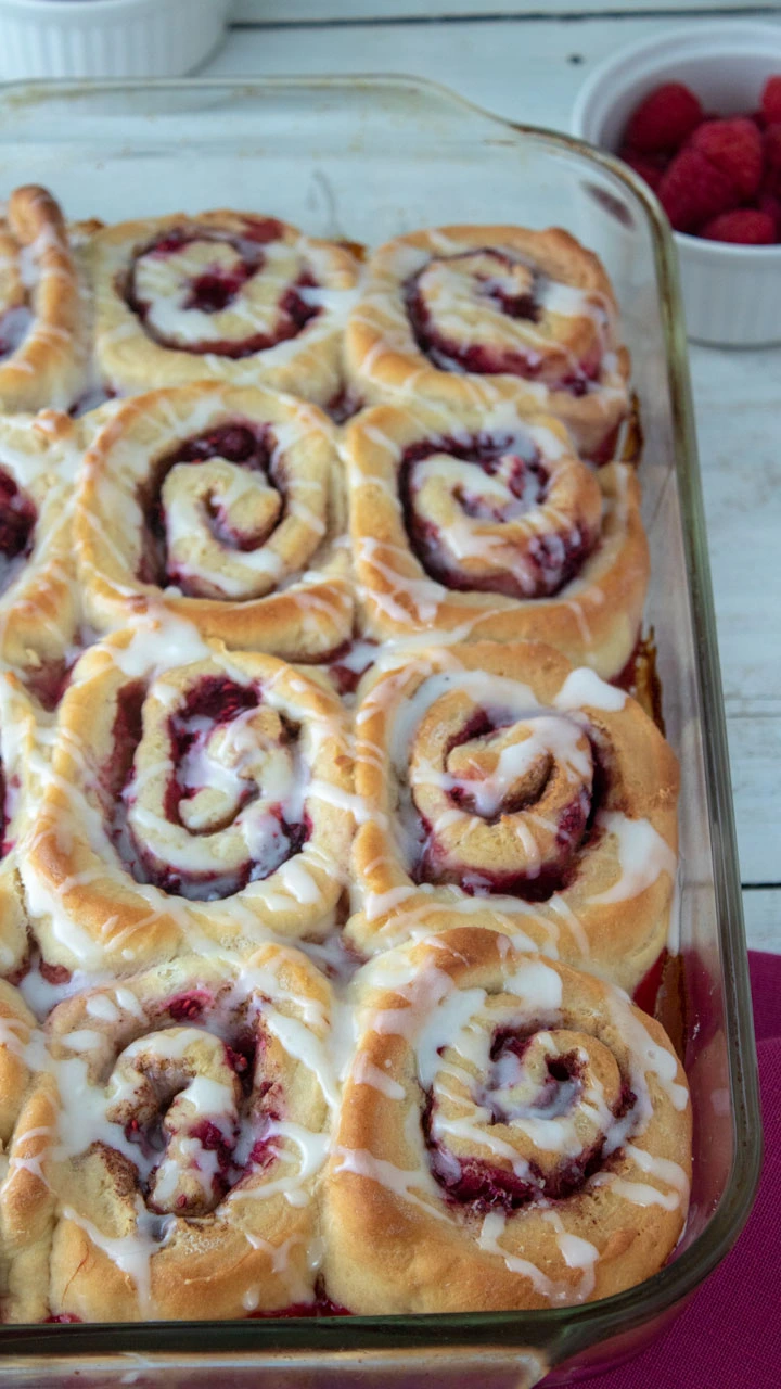 Raspberry Cinnamon rolls in a glass baking tray