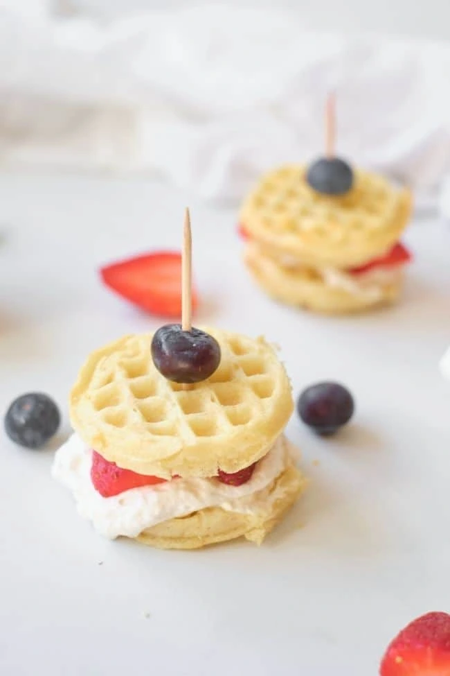 Waffle sandwich with strawberries and blueberries