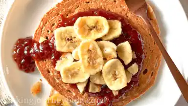 Serve with syrup, jam and banana slices.