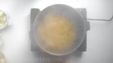 Boil large pot of water with salt. Cook macaroni al dente (2-3 minutes less than instructed on the package). Drain, but leave a ladle of pasta water aside.