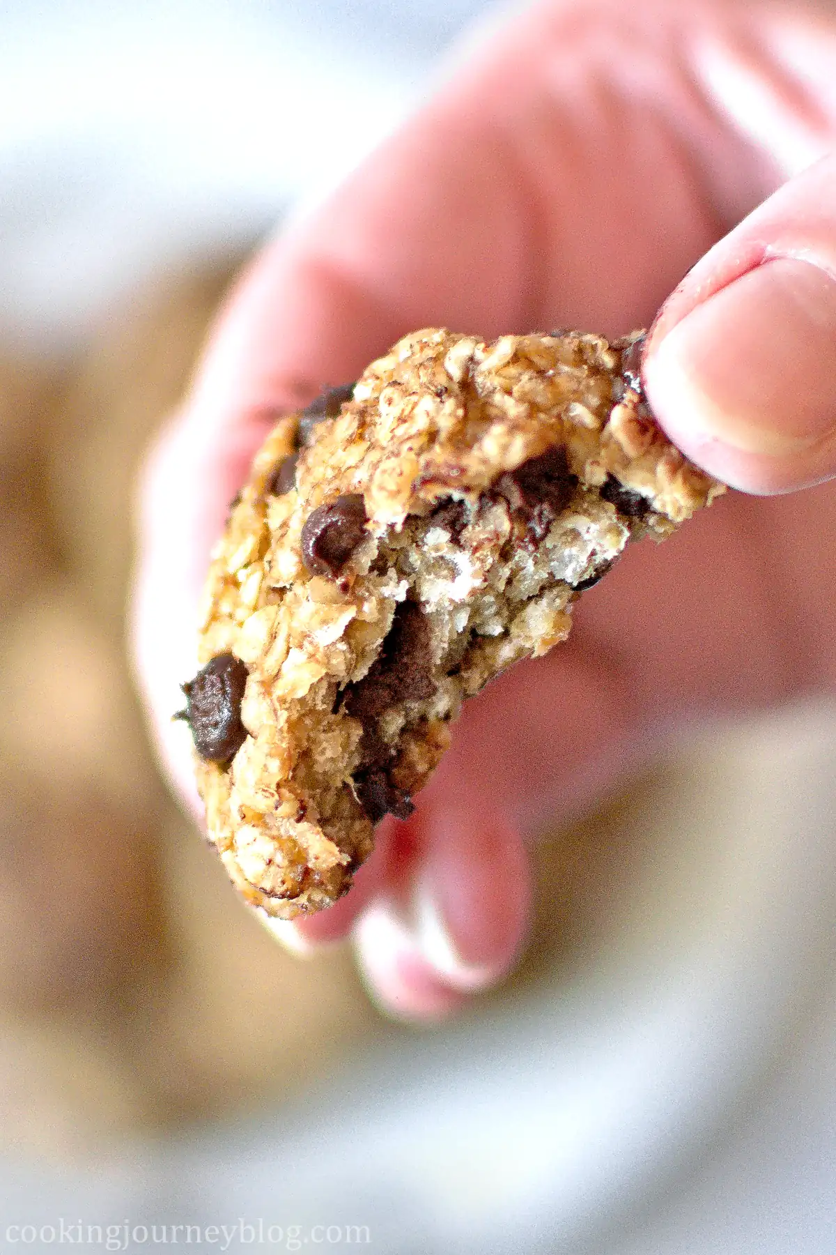 A bite of a 3 Ingredient Oatmeal Banana Cookie in the hand