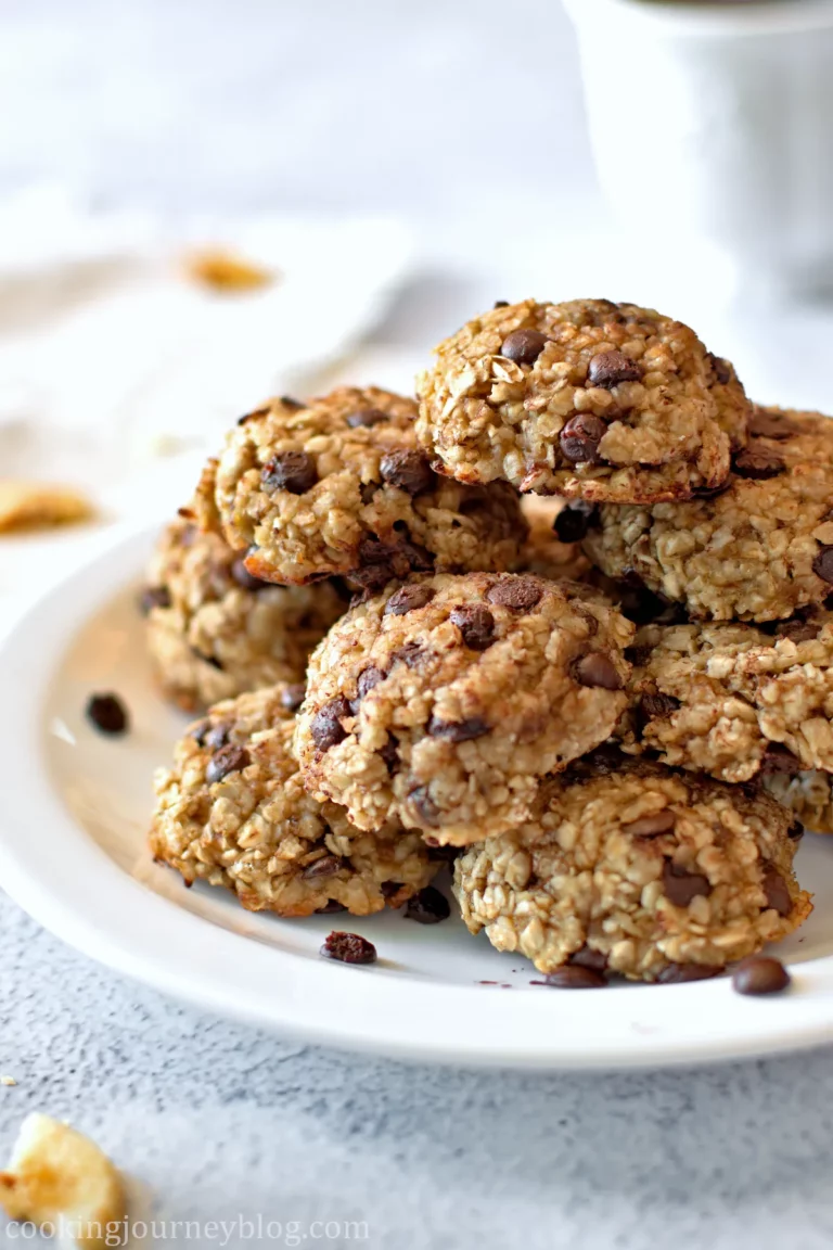 3 Ingredient Oatmeal Banana Cookies served with a cup of tea on a white plate