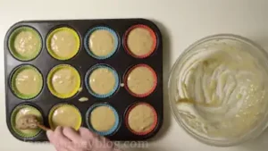 Line muffin tins and spread the batter until top.