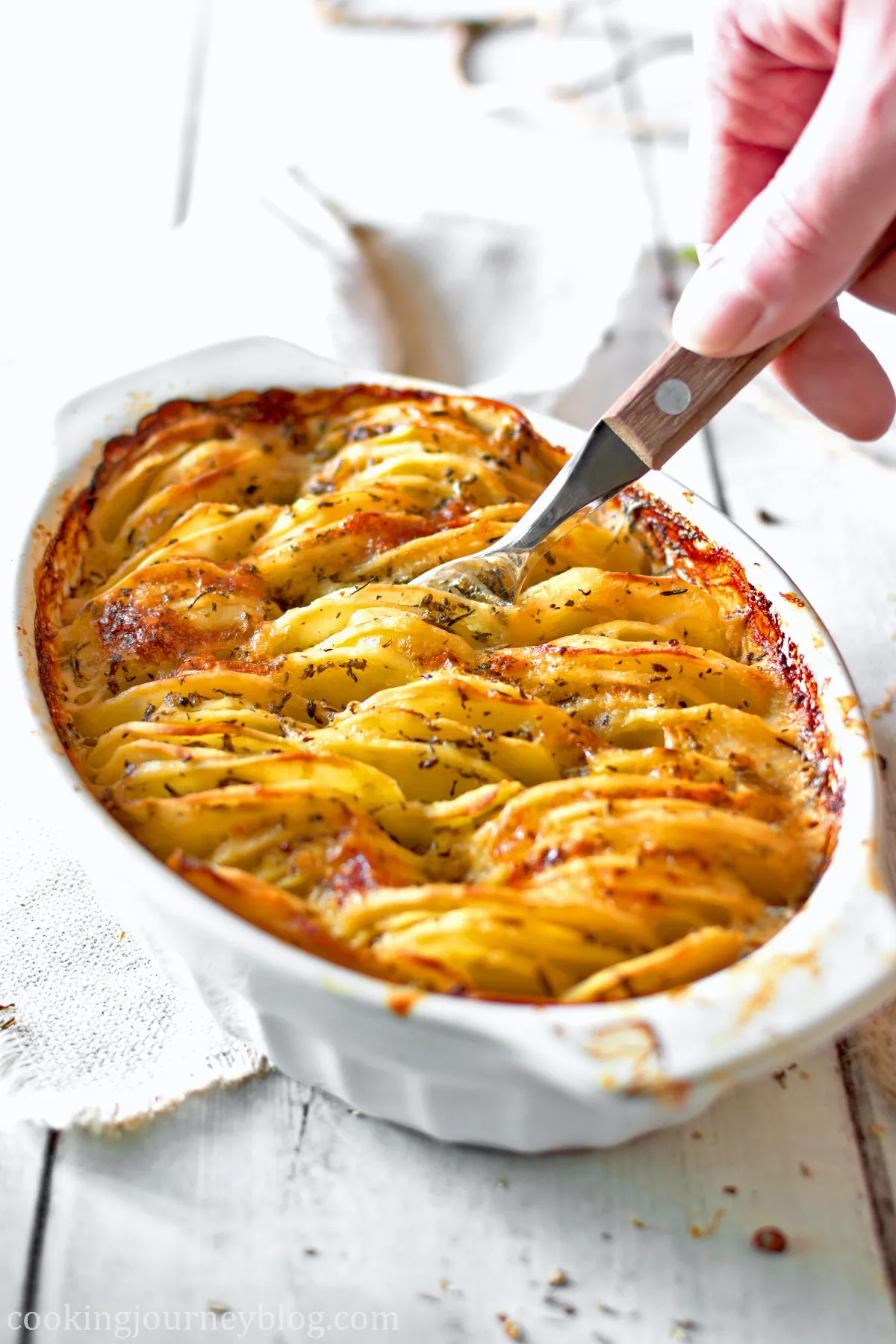 Hasselback Potato Gratin with a fork
