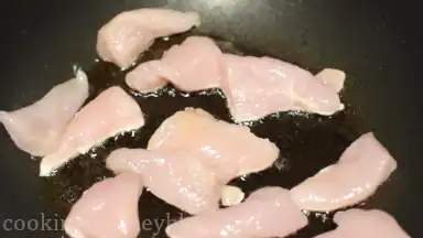 Add chicken pieces to the pan.