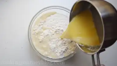 Add the liquid in the bowl with flour.