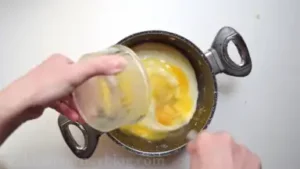 Remove from heat and slowly whisk in eggs. Let it cool.