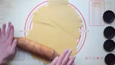 Roll the dough with the rolling pin.