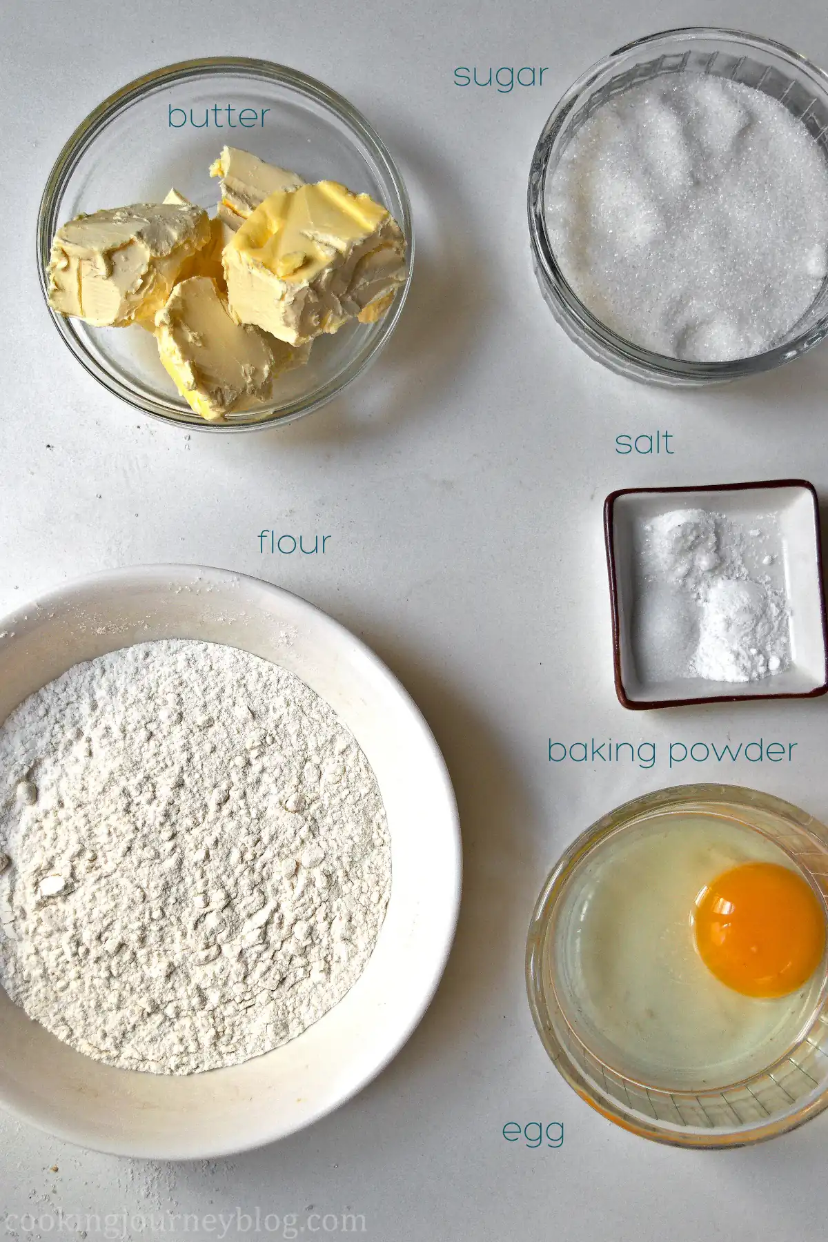 Tiramisu Cookies Ingredients in the bowls - butter, sugar, salt, baking powder, flour, egg.